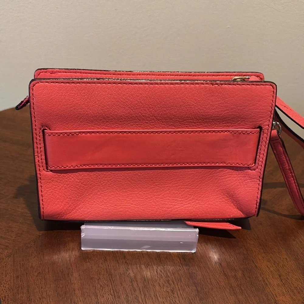 Kate Spade wristlet  pebble leather/patent bow on front  orangeish red gold NWOT